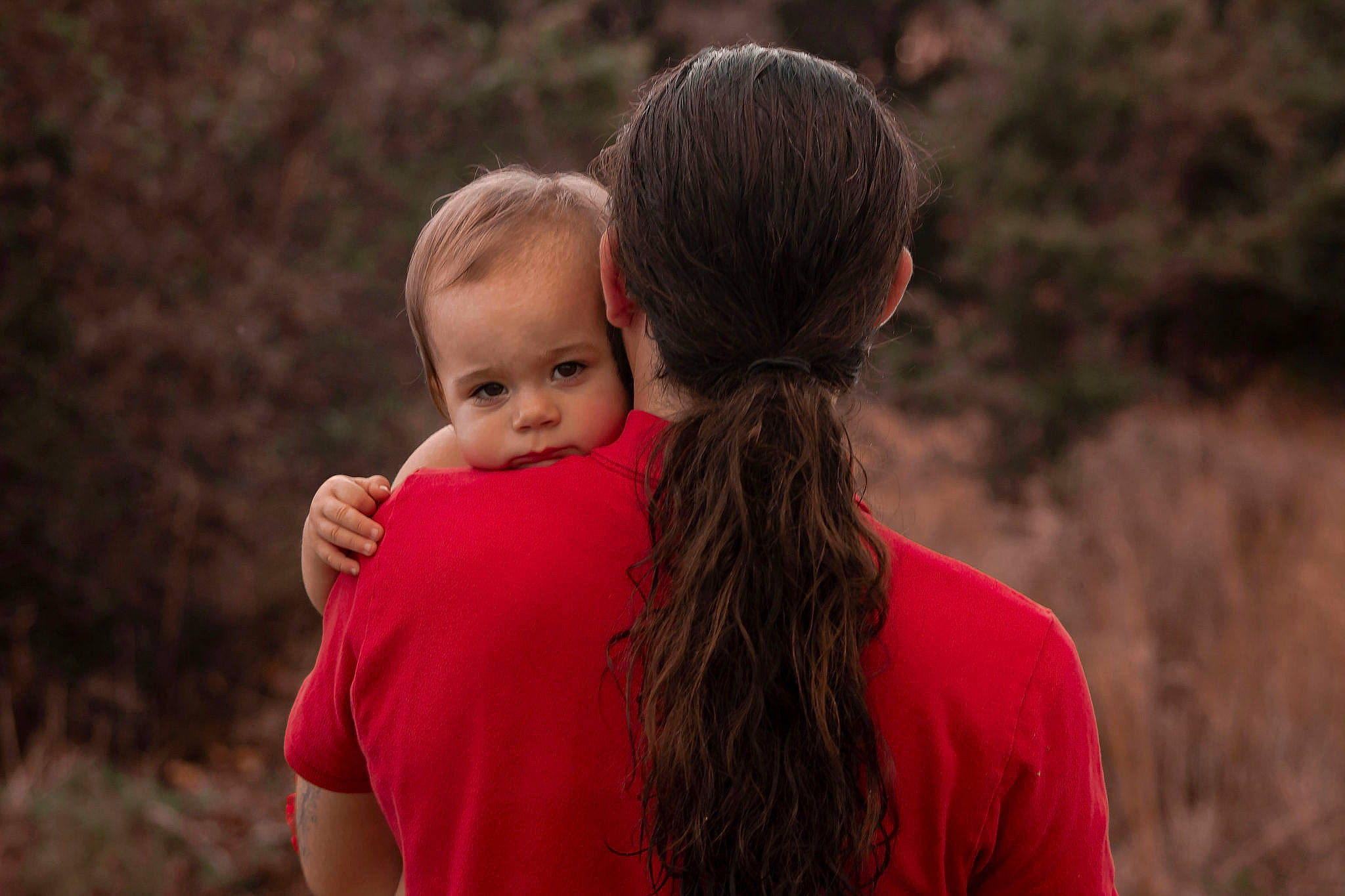 Korra is registered to the contest to win money with this photo: baby, child, flash_photography, fun, gesture, grass, grassland, happy, hug, landscape, leisure, love, people_in_nature, person, prairie, recreation, romance, soil, t_shirt, toddler