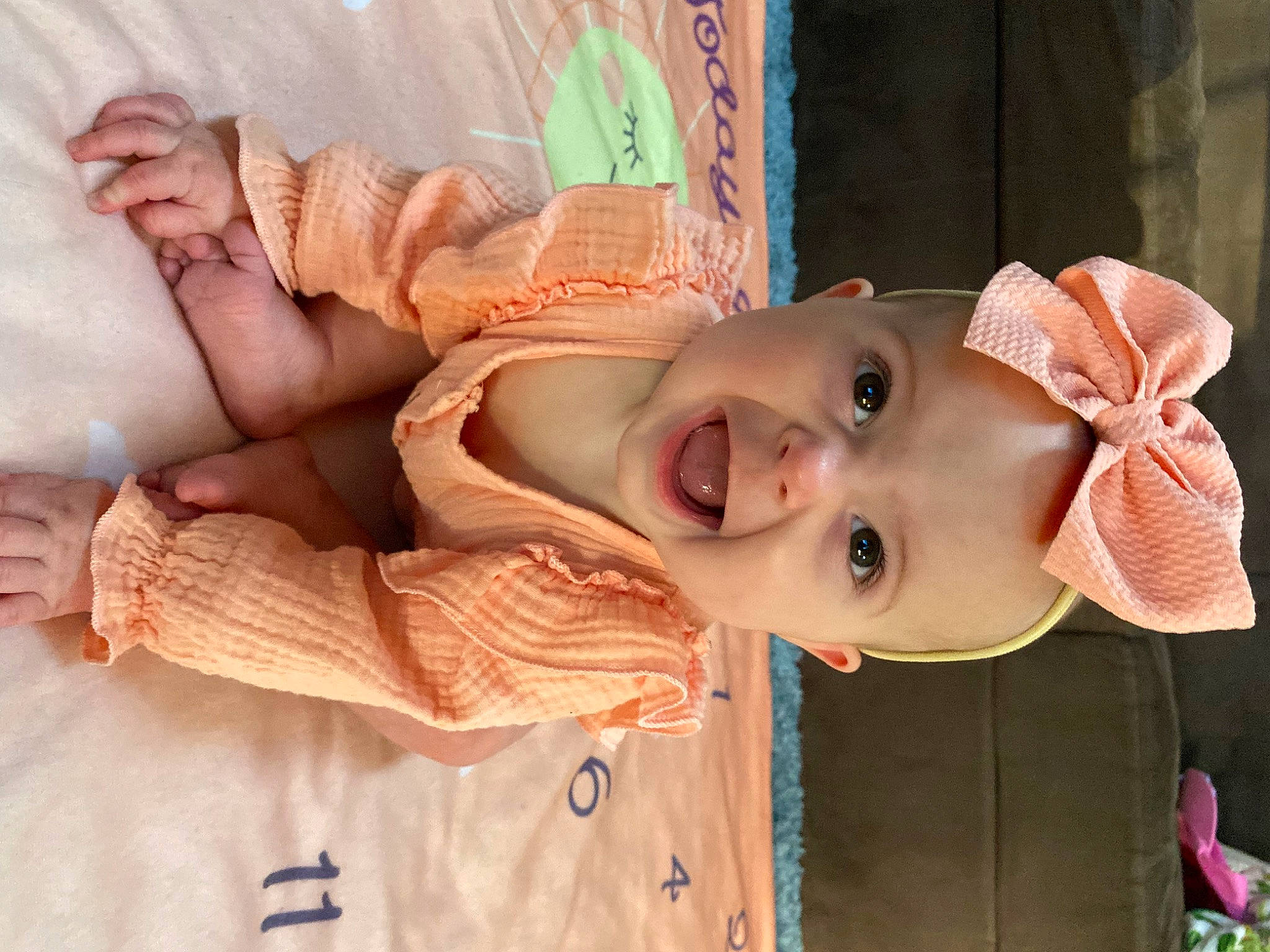 Terra is registered to the contest to win money with this photo: baby, cheek, child, eye, happy, hat, headgear, lip, mouth, neck, nose, person, pink, product, skin, smile, sun_hat, textile, toddler, window