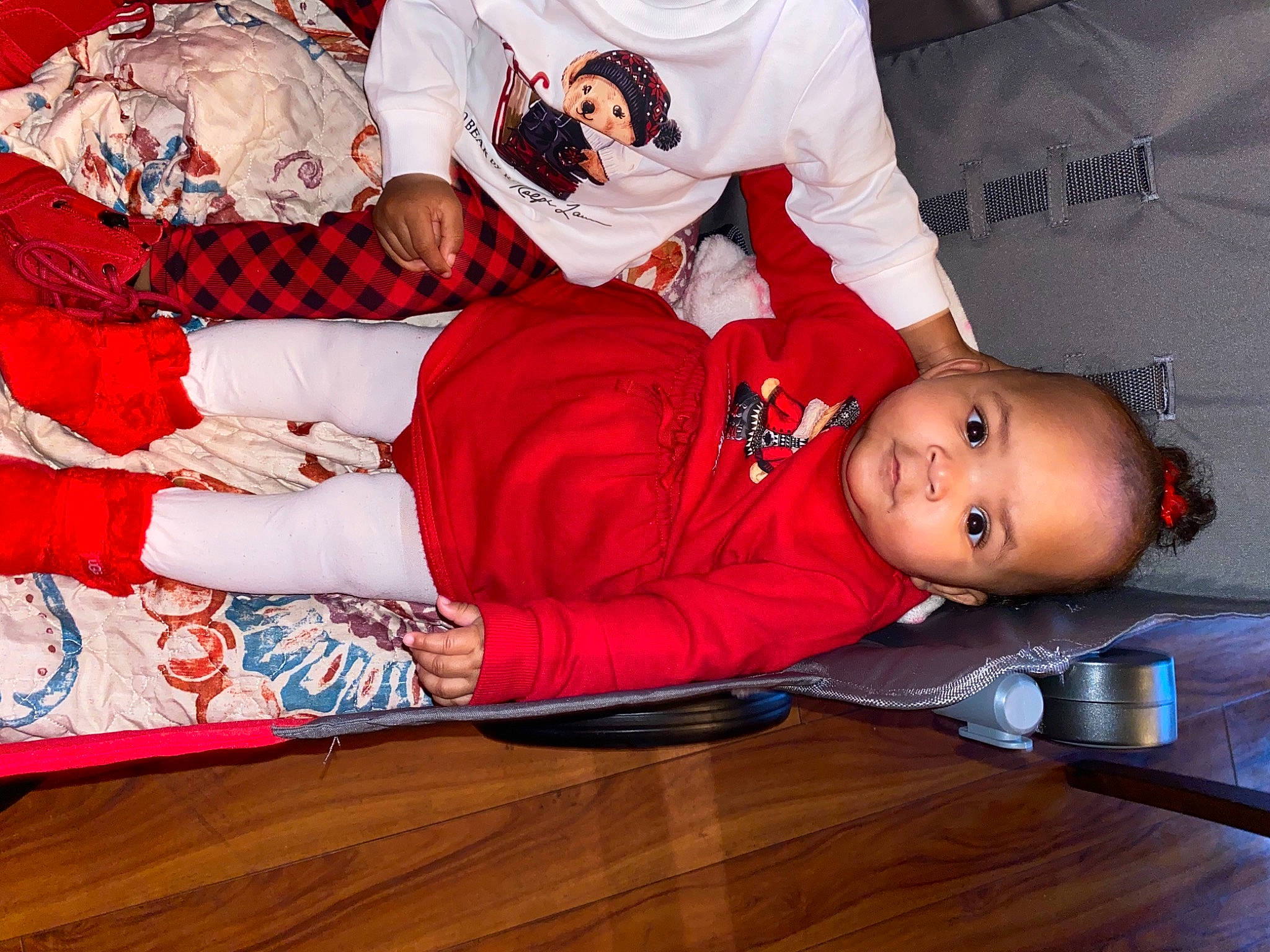 Royale is registered to the contest to win money with this photo: baby, carmine, child, comfort, event, fun, hardwood, hat, holiday, lap, linens, pattern, person, room, sitting, sleeve, t_shirt, textile, thigh, toddler