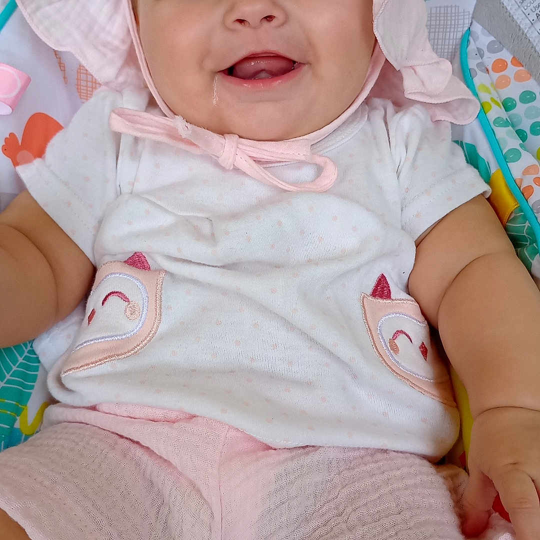 Emrey joined the competition — help win amazing prizes! baby, bodypart, bonnet, cap, clothing, face, finger, hand, happy, hat, head, newborn, person, photography, portrait, shorts, sitting, smile, sunhat, t_shirt