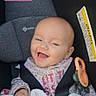 Aurora joined the competition — help win amazing prizes! baby, infant, child, smiling, laughing, portrait, car_seat, seatbelt, bib, teething_toy, blanket, floral_clothing, indoor, vehicle, happy, face, head, social_media, screenshot, warning_label