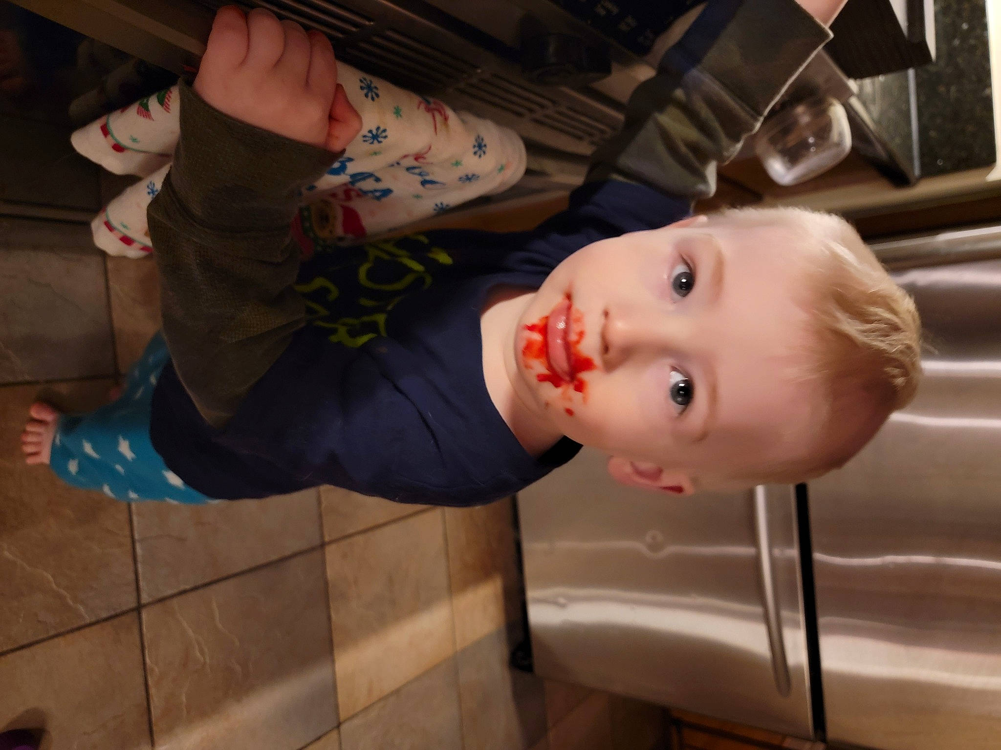 Cade is registered to the contest to win money with this photo: baby, baby_products, baby_toddler_clothing, cheek, child, dress, eyelash, flooring, fun, mouth, nose, person, room, sitting, toddler, wood