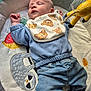 Reece joined the competition — help win amazing prizes! baby, sleeping, bib, bear_pattern, blue_clothing, jeans, plush_toy, giraffe, play_mat, sloth_design, pacifier, soft_texture, child, infant, peaceful, cute, cozy, indoor, resting, toddler