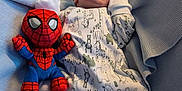 Reece joined the competition — help win amazing prizes! newborn, baby, sleeping, onesie, animal_print, blanket, plush_toy, spiderman, soft_light, cozy, infant, bed, cute, resting, indoor, child, toy, peaceful, snug, portrait