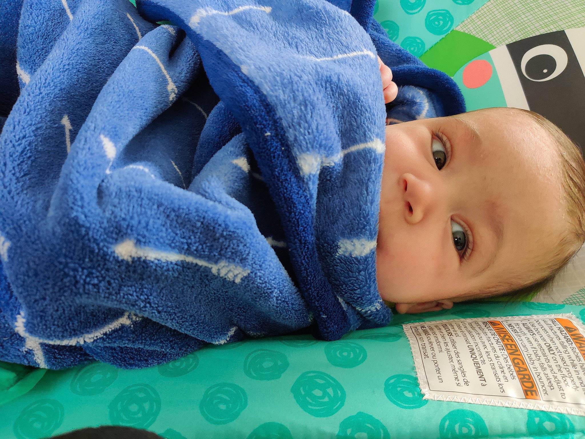 Ivar is registered to the contest to win money with this photo: azure, baby, baby_products, baby_toddler_clothing, bedding, bedtime, blanket, blue, child, close_up, comfort, electric_blue, linens, nap, pattern, person, sleep, textile, toddler