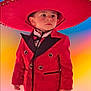 boy, celebration, child, colorful_background, costume, cute, face, fashion, festive, formal_wear, hat, person, photography, portrait, red_suit, serious_expression, sombrero, standing, traditional_clothing, young