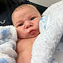 Terry joined the competition — help win amazing prizes! baby, infant, face, blue_eyes, blanket, soft_texture, close_up, skin, newborn, cute, child, portrait, cuddle, warmth, comfort, expression, head, person, indoors, resting