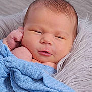 Terry joined the competition — help win amazing prizes! baby, newborn, blanket, blue, cushion, face, infant, sleepy, soft, wrapped, cute, resting, skin, closeup, child, person, portrait, indoors, warm, peaceful