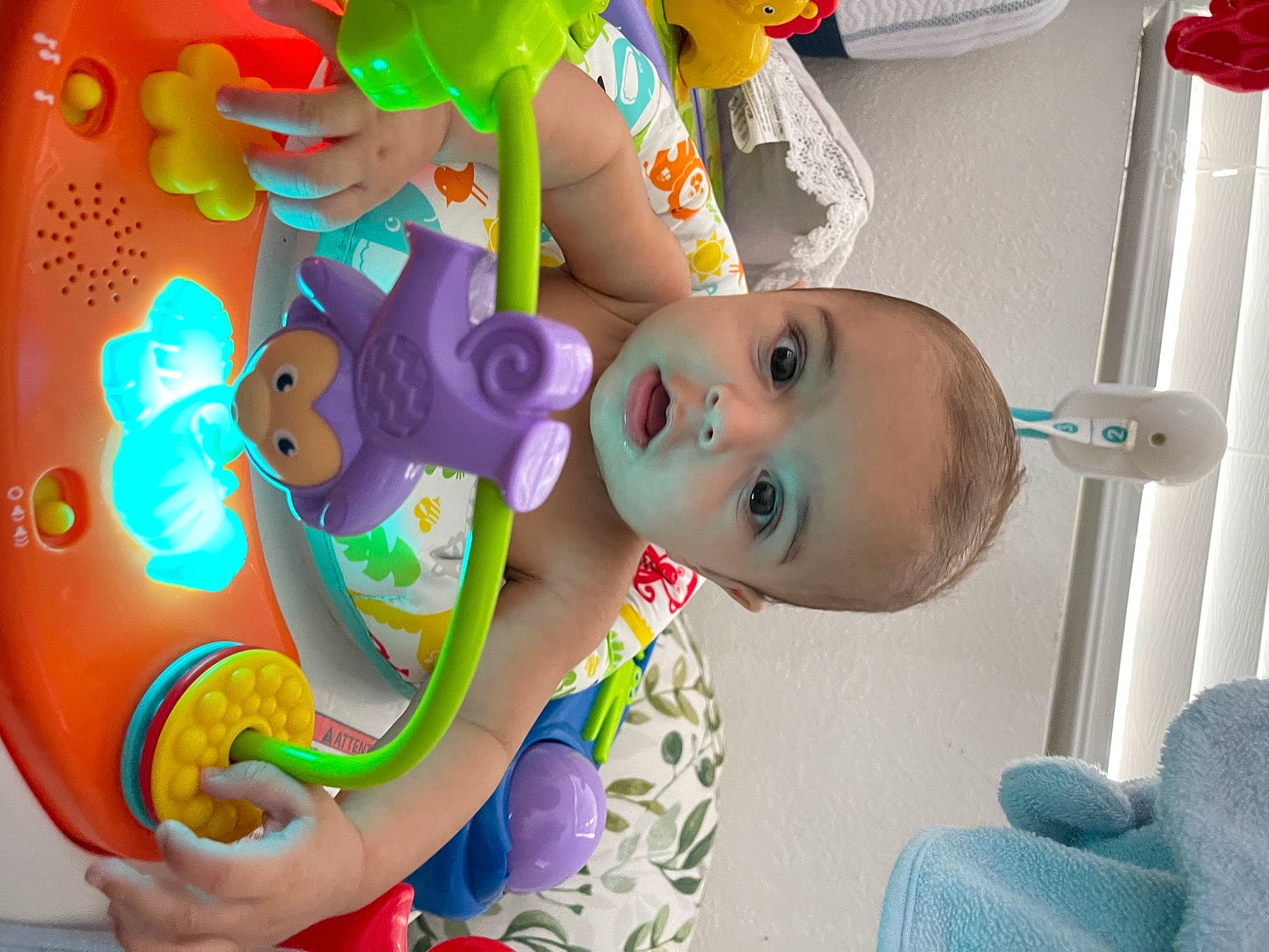 Haidyn is registered to the contest to win money with this photo: animation, art, baby_products, baby_toys, child, fictional_character, fun, happy, leisure, party_supply, person, plant, plastic, play, recreation, shelf, stuffed_toy, toy, tree, visual_arts