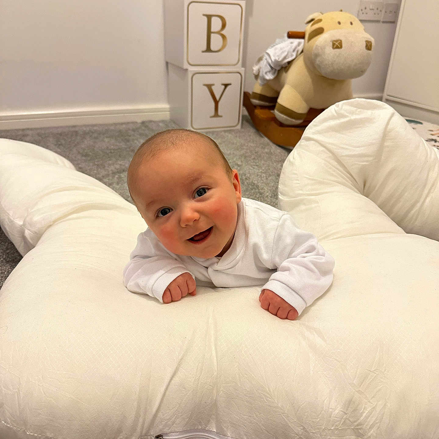 Jaxon is registered to the contest to win money with this photo: baby, beanbag, bed, bedroom, blanket, couch, crawling, cushion, face, furniture, head, homedecor, indoors, person, photography, pillow, portrait, room, toy