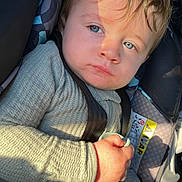 Logan L Greene joined the competition — help win amazing prizes! child, toddler, baby, car_seat, buckled, portrait, face, blue_eyes, blond_hair, sitting, indoors, vehicle, sunlight, sweater, clothing, hand, toy, seatbelt, close_up,  안전