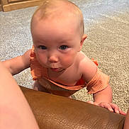 Maelle is registered to the contest to win money with this photo: baby, babycrawling, bodypart, cabinet, cartoon, crawling, face, finger, furniture, hand, head, person, photography, portrait