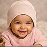 baby, smiling, child, infant, face, pink_hat, pink_sweater, knitwear, happy, cute, portrait, closeup, indoors, warm, soft_light, cozy, young_child, headwear, expression, person