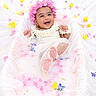 Avika is registered to the contest to win money with this photo: baby, infant, smiling, flower_crown, milky_bath, pink_flowers, yellow_flowers, blue_flowers, white_clothing, happy, splashing, water, portrait, cute, skin, toddler, playful, soft_lighting, indoors, decorative