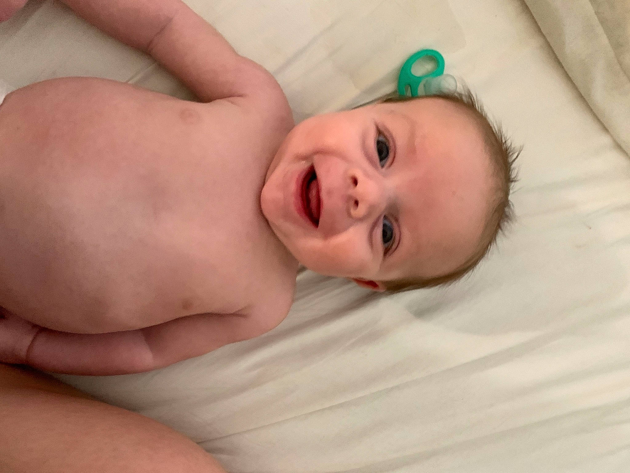 Jaxson joined the competition — help win amazing prizes! baby, baby_laughing, baby_toddler_clothing, cheek, comfort, eye, eyelash, finger, gesture, happy, human_body, iris, linens, lip, nail, nose, person, skin, smile, thumb