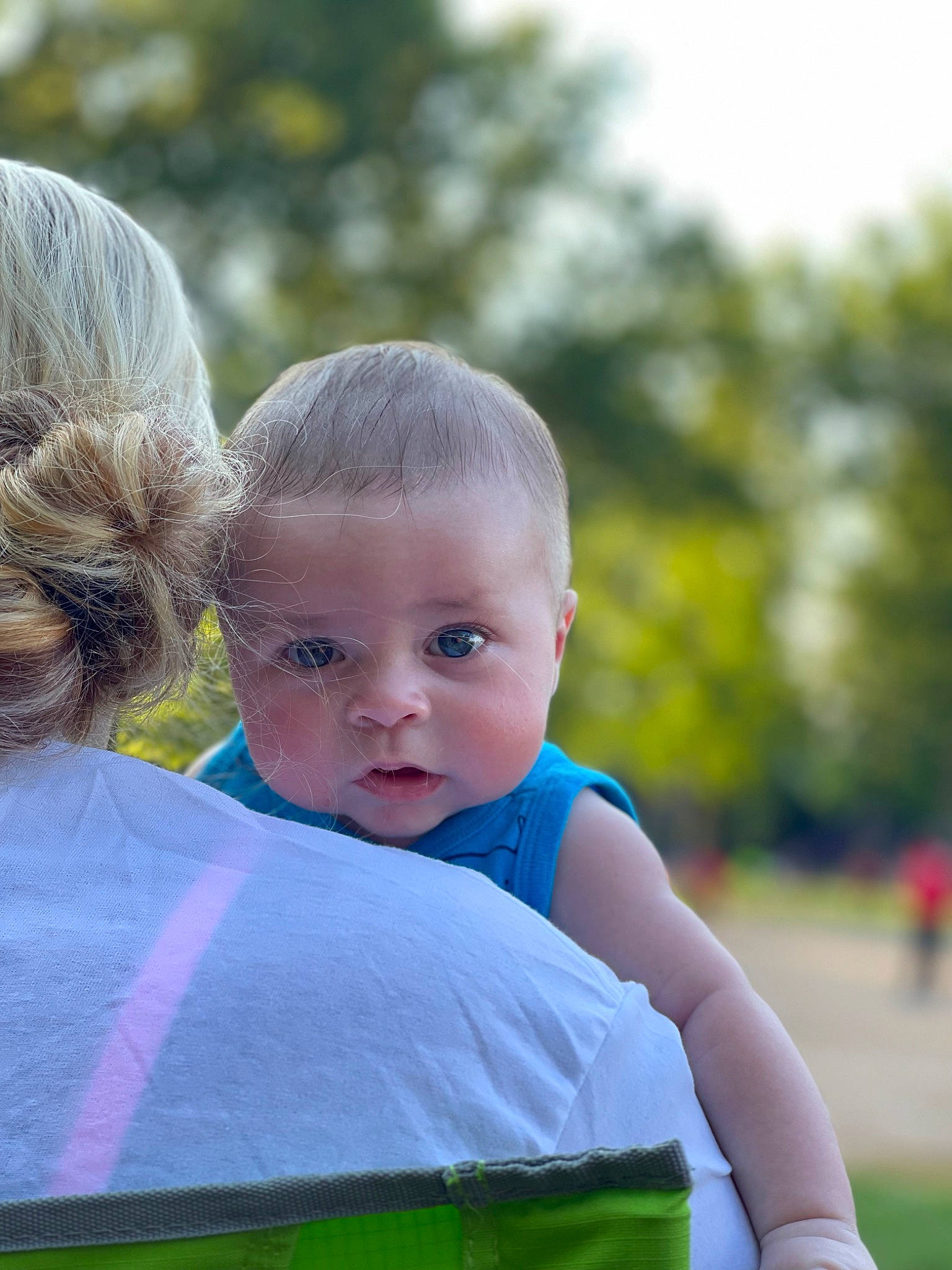 Chandler is registered to the contest to win money with this photo: baby_toddler_clothing, electric_blue, eye, fun, grass, grass_family, hair, happy, human_body, iris, joint, leaf, leisure, people_in_nature, person, recreation, sitting, skin, t_shirt, toddler