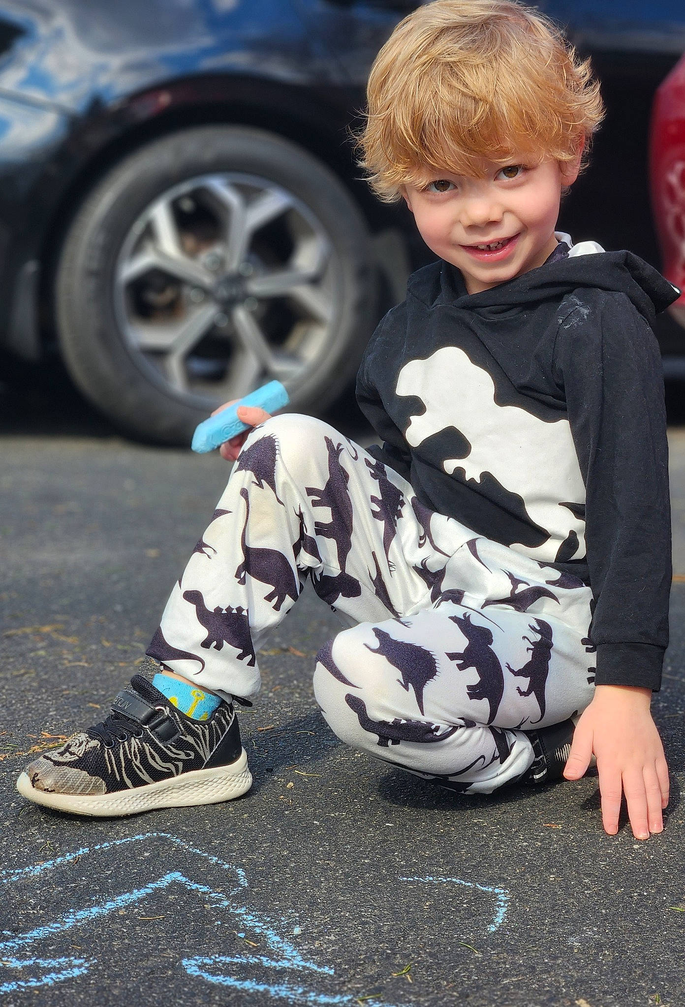 Bryson joined the competition — help win amazing prizes! art, asphalt, automotive_design, automotive_exterior, automotive_tire, black, blue, car, child, joy, motor_vehicle, person, photograph, shoe, smile, snapshot, sneakers, tire, toddler, vehicle