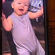 Easton joined the competition — help win amazing prizes! baby, child, smiling, happy, romper, sleeveless, person, face, arm, holding, striped_shirt, candid, indoor, joyful, infant, portrait, human, skin, expression, clothing