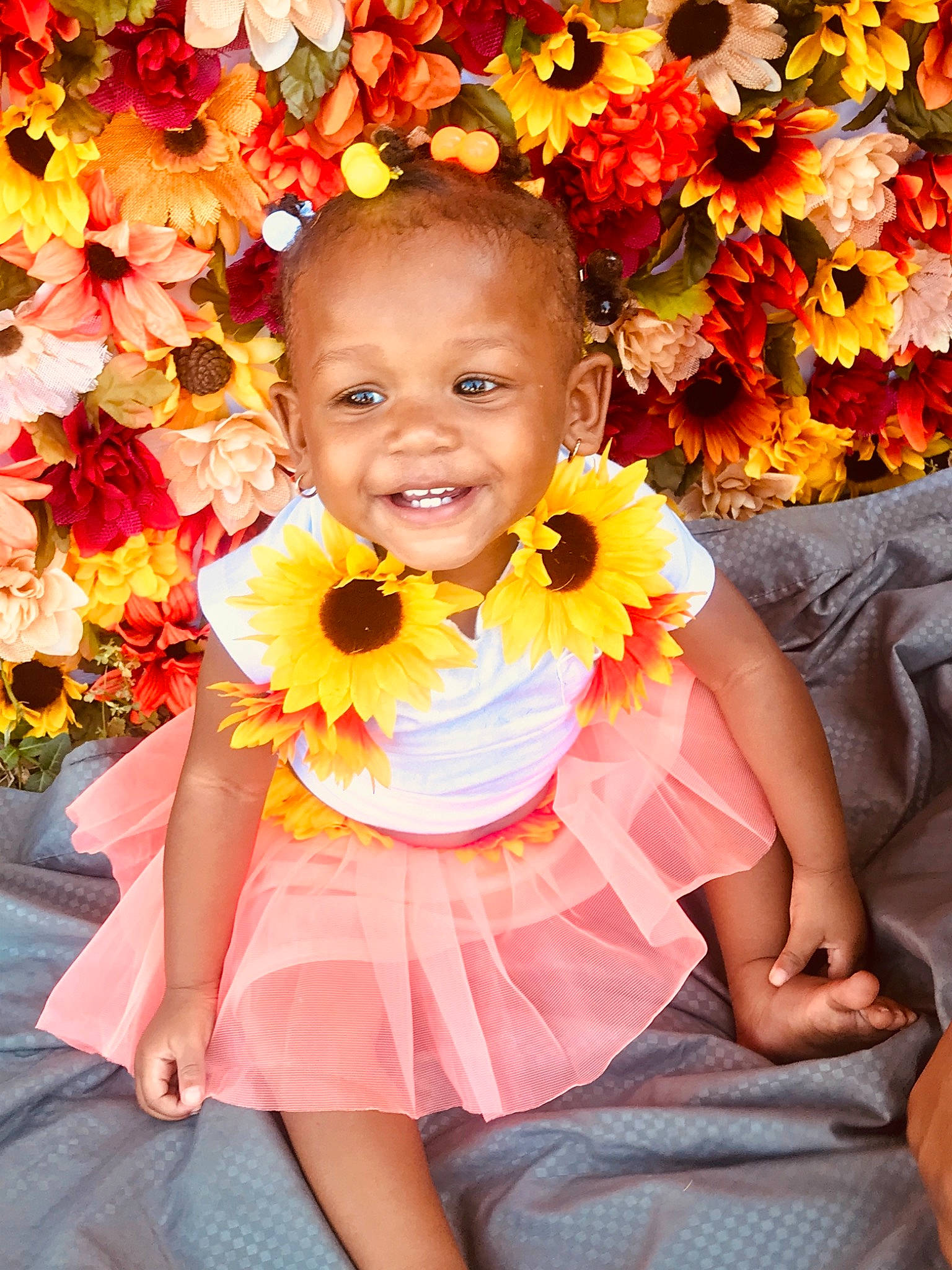 Jream is registered to the contest to win money with this photo: baby_toddler_clothing, beauty, bouquet, child, cut_flowers, event, facial_expression, flower, flower_arranging, happy, joy, orange, people_in_nature, person, petal, photograph, pink, plant, red, smile
