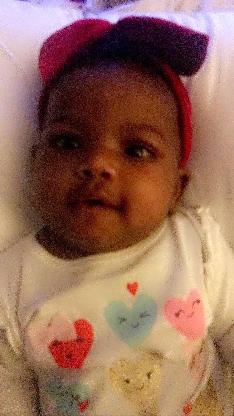 Fendi is registered to the contest to win money with this photo: cheek, chin, eye, eyebrow, face, facial_expression, forehead, happy, head, lip, mouth, nose, organ, outerwear, person, pink, skin, sleeve, smile, textile