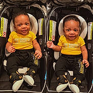 Yazhir is registered to the contest to win money with this photo: baby, infant, car_seat, yellow_shirt, black_pants, sneakers, smile, child, cute, indoors, seat, toddler, fashion, portrait, happy, two_children, people, clothing, person, baby_fashion