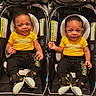 baby, infant, car_seat, yellow_shirt, black_pants, sneakers, smile, child, cute, indoors, seat, toddler, fashion, portrait, happy, two_children, people, clothing, person, baby_fashion