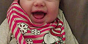 Lakelyn joined the competition — help win amazing prizes! baby, babylaughing, blanket, bodypart, clothing, couch, cushion, face, furniture, happy, head, homedecor, laughing, newborn, person, photography, portrait, quilt, scarf, smile