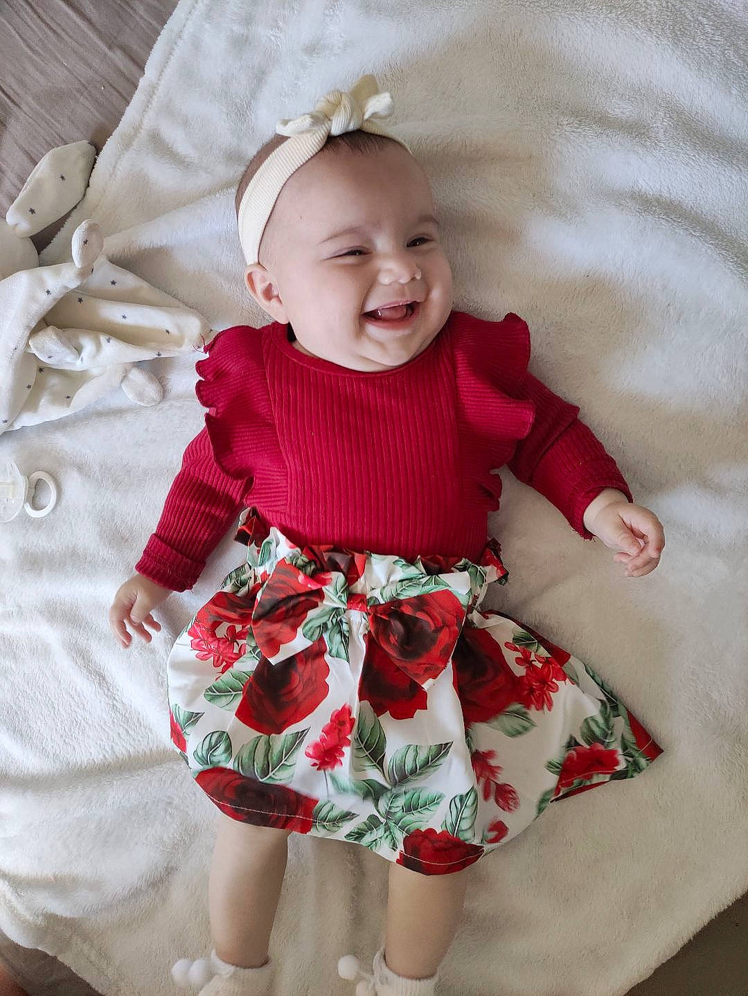 Ava participe au concours pour gagner de l'argent avec cette photo : baby, baby_toddler_clothing, day_dress, dress, eye, face, happy, head, iris, one_piece_garment, outerwear, pattern, person, pink, product, skin, sleeve, smile, textile, toddler