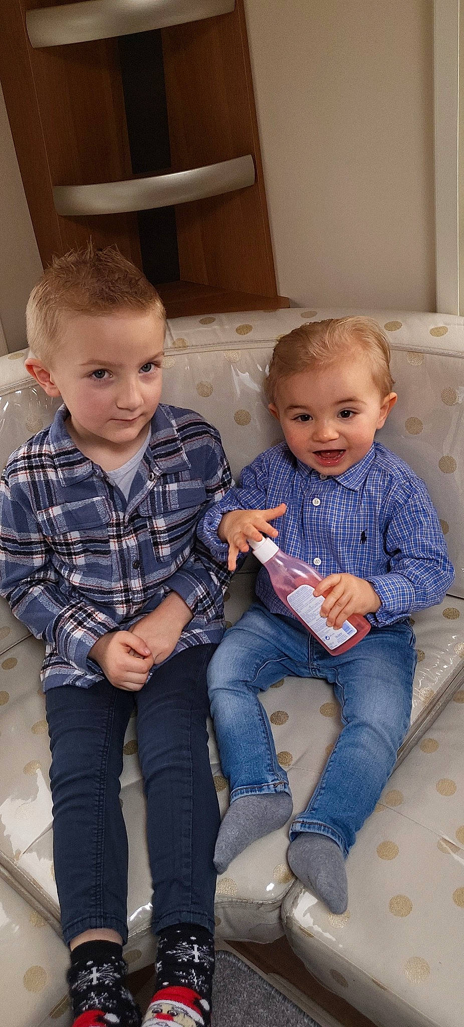 Isaac participe au concours pour gagner de l'argent avec cette photo : baby_toddler_clothing, chair, clothing, comfort, couch, denim, fun, happy, jeans, lap, leg, person, plaid, sitting, skin, sleeve, smile, standing, t_shirt, tartan