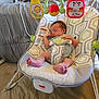 Everlee is registered to the contest to win money with this photo: baby, newborn, sleeping, baby_rocker, toy, colorful_toy, infant, patterned_fabric, indoor, bedroom, fisher_price, baby_clothing, comfortable, resting, foot, hand, infant_seat, child, soft_lighting, home