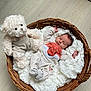 baby, newborn, basket, teddy_bear, soft_toy, onesie, fox_design, white_fabric, cushion, flooring, wood_floor, cute, sleeping, infant, child, plush, cozy, resting, indoors, home