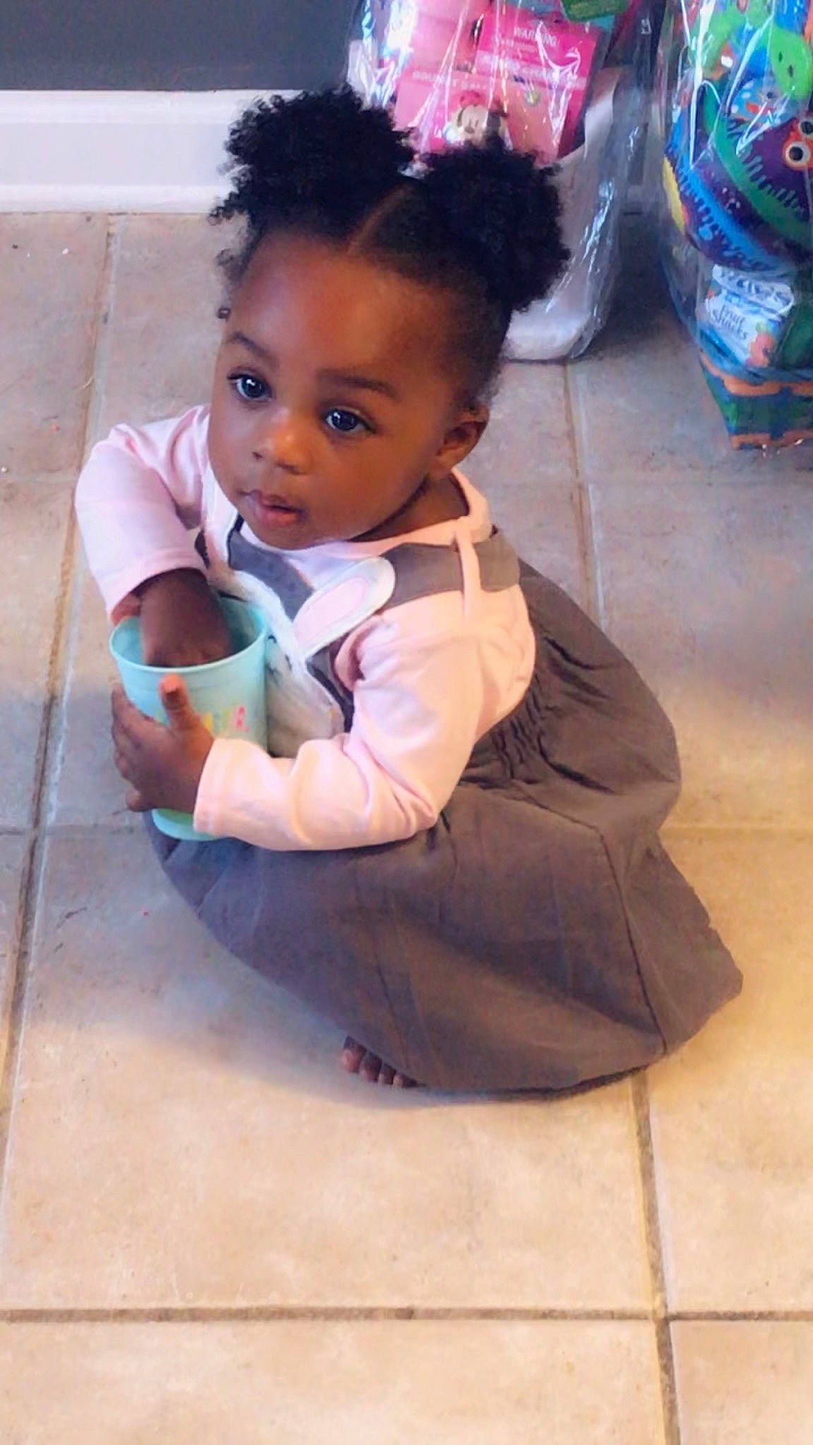 Indy is registered to the contest to win money with this photo: baby, black_hair, cheek, child, floor, flooring, hair, hairstyle, person, sitting, skin, toddler