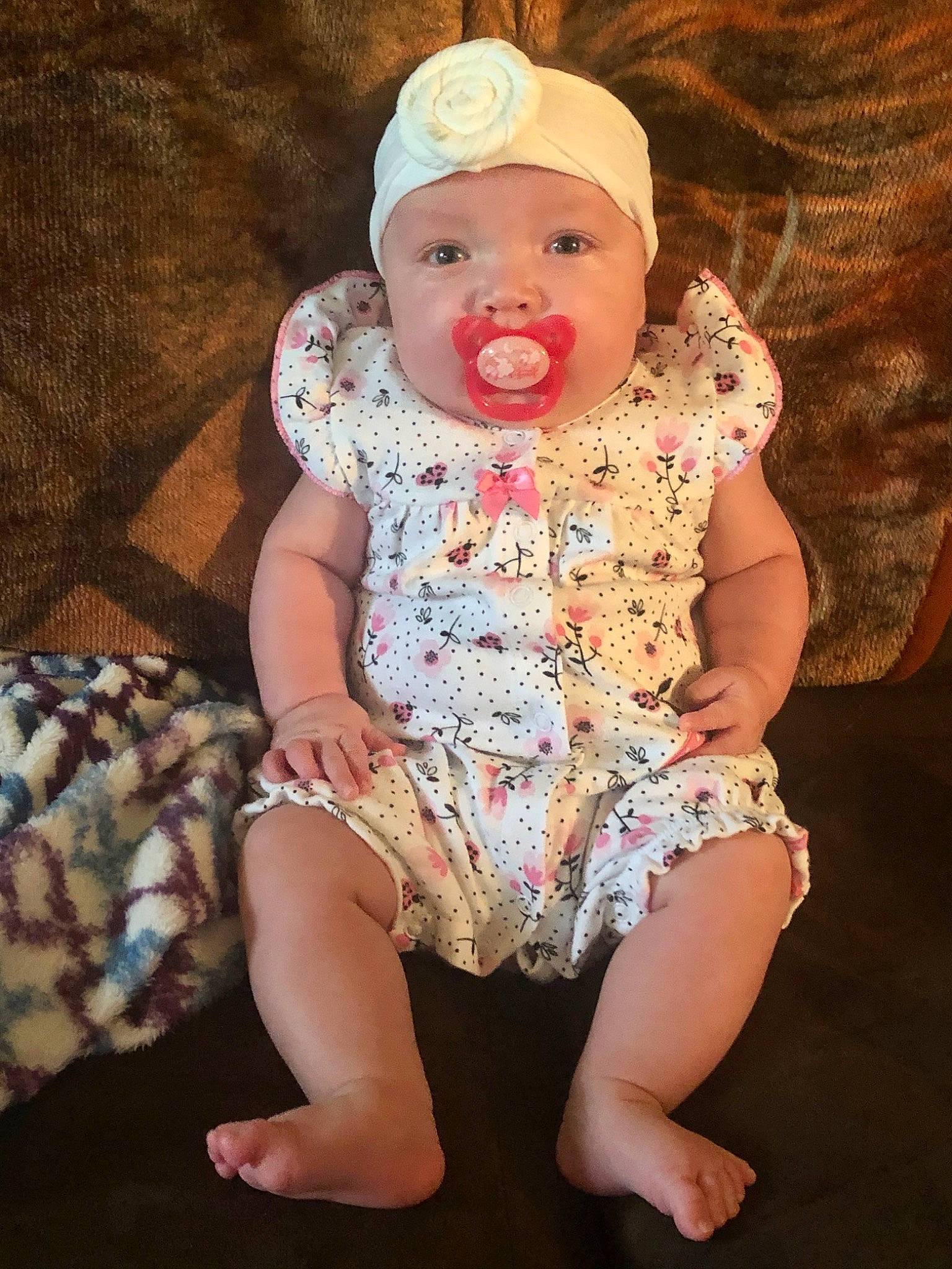 Alita is registered to the contest to win money with this photo: baby, baby_toddler_clothing, child, headgear, headwear, person, sitting, toddler