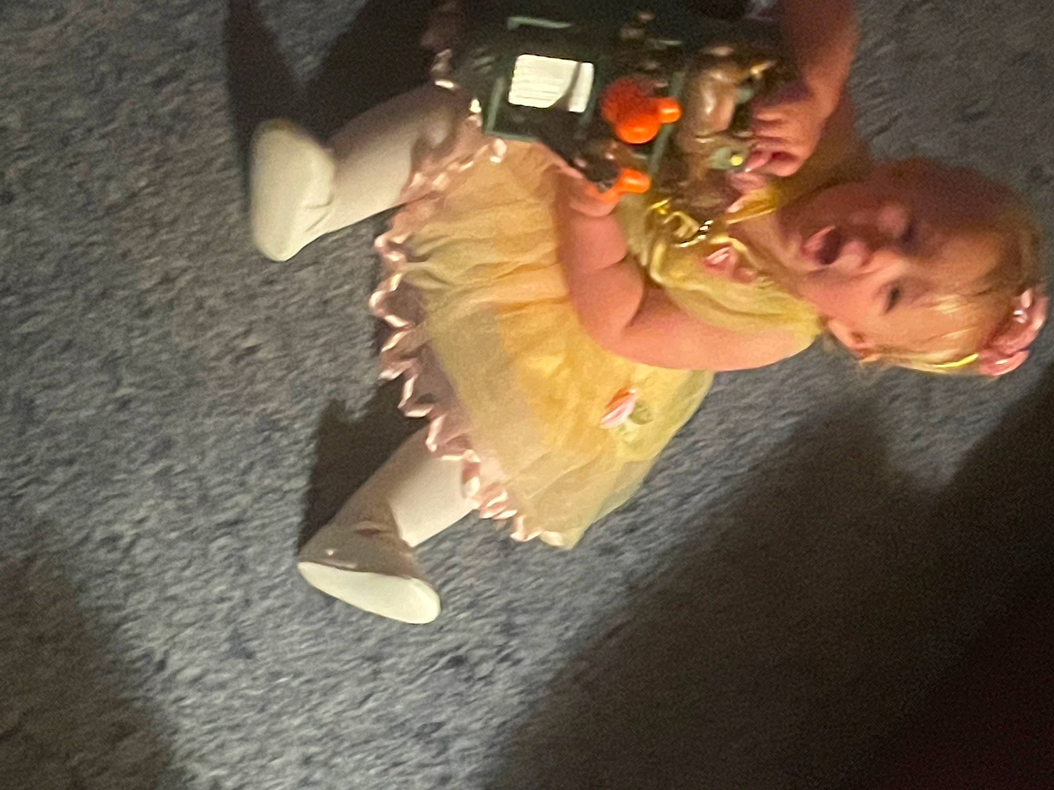 Nevaeh joined the competition — help win amazing prizes! bumper, camera, child, darkness, elbow, event, flash_photography, flooring, fun, gesture, happy, heat, human_leg, night, person, personal_protective_equipment, sitting, sky, toddler, wing