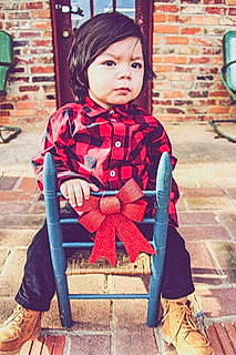 Erick joined the competition — help win amazing prizes! child, child_model, clothing, coat, costume, jacket, outerwear, person, sitting