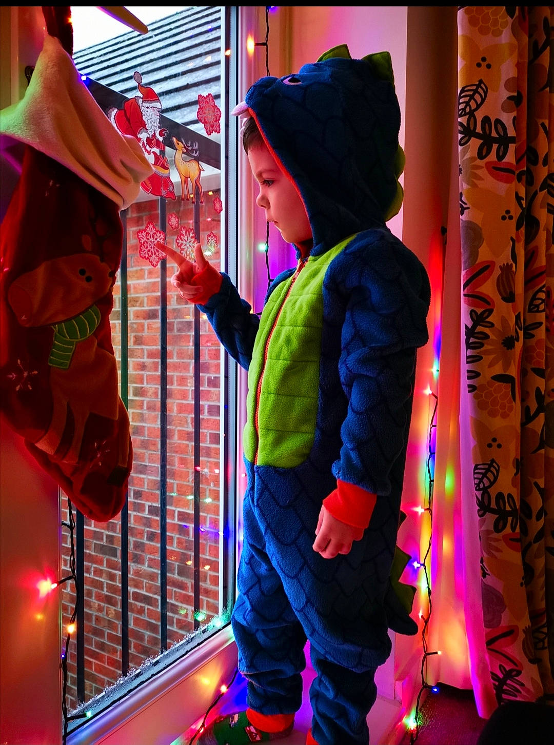 Alexandru is registered to the contest to win money with this photo: beanie, bonnet, costume_accessory, costume_hat, curtain, headgear, holiday, knit_cap, magenta, neon, person