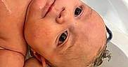 Raeshayn joined the competition — help win amazing prizes! baby, bathtub, bath, water, wet_skin, child, infant, cute, face, head, skin, expression, relaxing, indoors, shampoo, small_hands, toddler, bath_time, close_up, human
