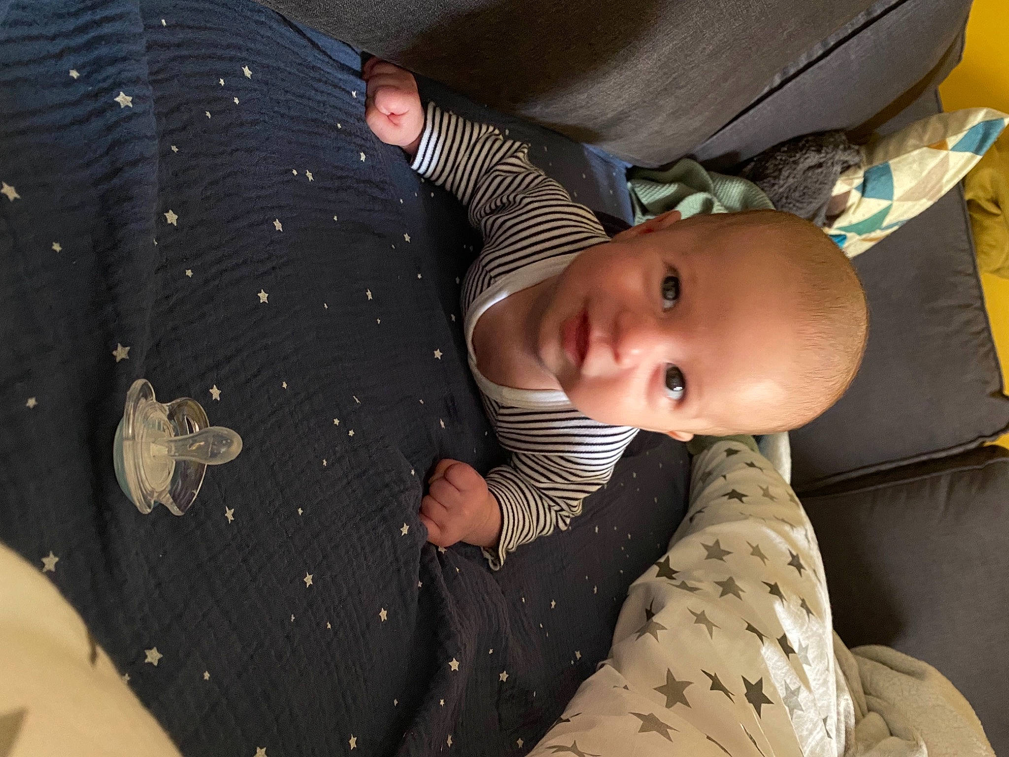 Isayah a rejoint le concours — aidez-le/la à gagner de superbes lots ! baby, baby_products, baby_toddler_clothing, child, comfort, couch, linens, nap, pattern, people, person, product, room, sitting, sleep, sleeve, textile, toddler, tree, white