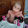 Kimberley a rejoint le concours — aidez-le/la à gagner de superbes lots ! baby, pacifier, tiara, walker, toy, hello_kitty, pink_clothing, indoor, child, furniture, wooden_cabinet, floor, curious, headband, playtime, infant, cute, person, sitting, clothing