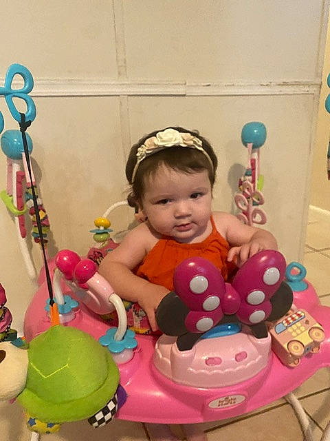 Scarlett is registered to the contest to win money with this photo: baby, baby_playing_with_toys, baby_products, baby_toddler_clothing, baby_toys, child, event, fun, happy, party, party_supply, people, person, pink, play, product, riding_toy, room, sitting, toddler