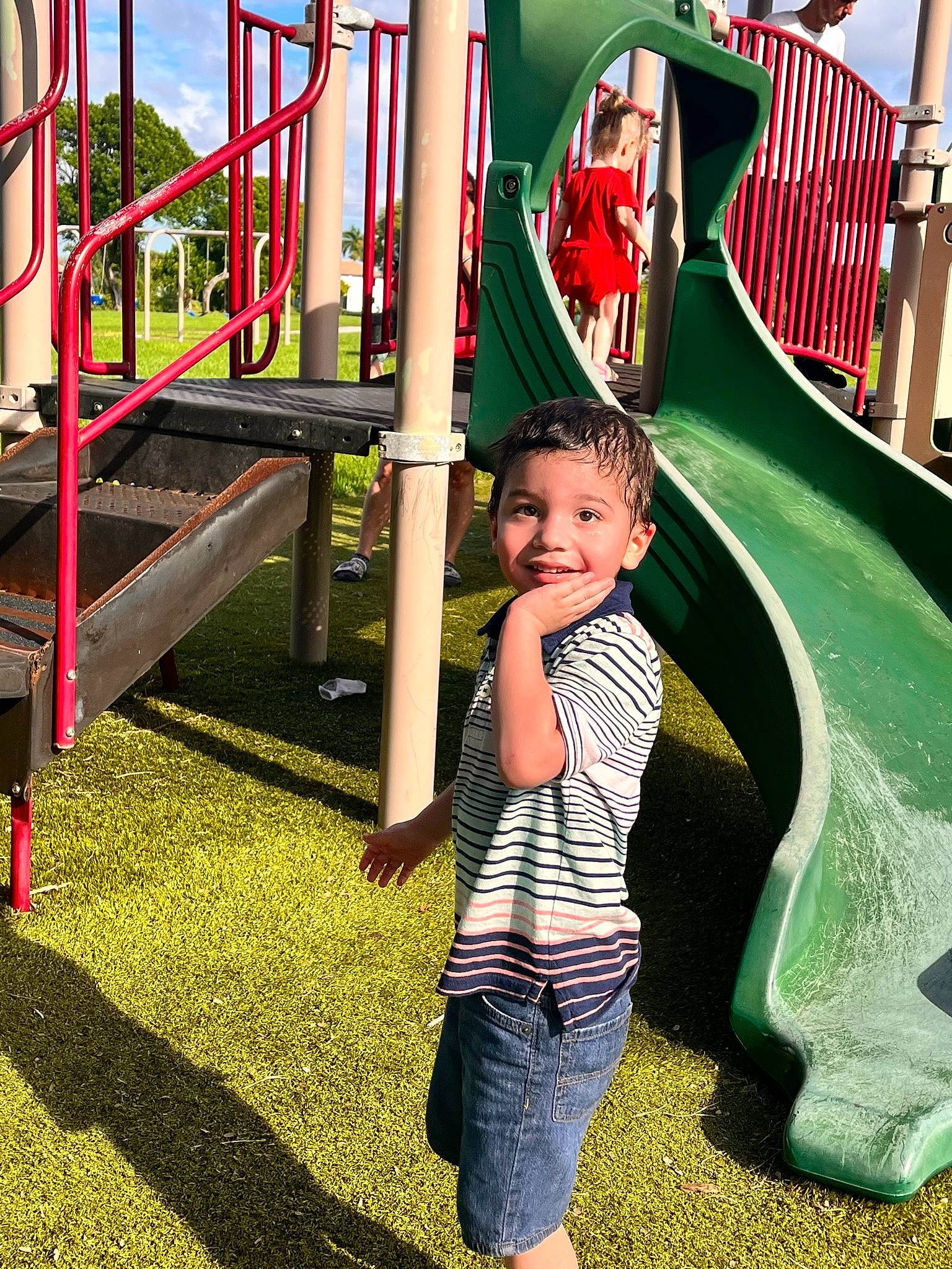 Sebastian joined the competition — help win amazing prizes! baby_toddler_clothing, child, chute, city, fun, grass, green, happy, joy, leisure, outdoor_play_equipment, person, plant, play, playground, playground_slide, recreation, red, smile, t_shirt