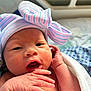 Aymee joined the competition — help win amazing prizes! newborn, baby, infant, hat, bow, striped_hat, hospital, blanket, wrapped, hand, face, skin, cute, portrait, closeup, sleepy, tiny, person, child, indoors