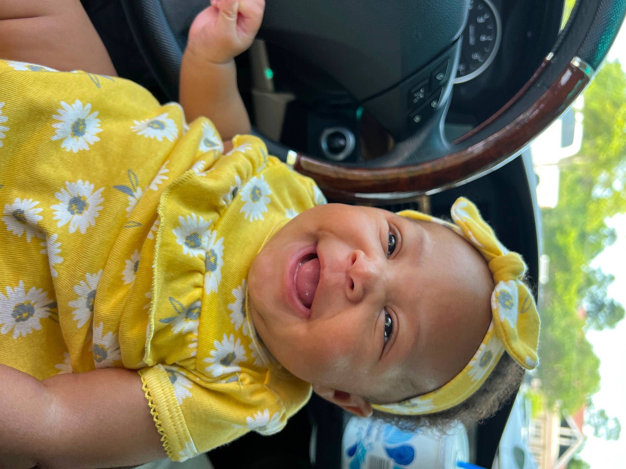Kali is registered to the contest to win money with this photo: auto_part, automotive_tire, automotive_wheel_system, baby, baby_laughing, child, fashion_accessory, fun, happy, hat, headwear, helmet, laugh, leisure, mouth, person, personal_protective_equipment, recreation, smile, toddler