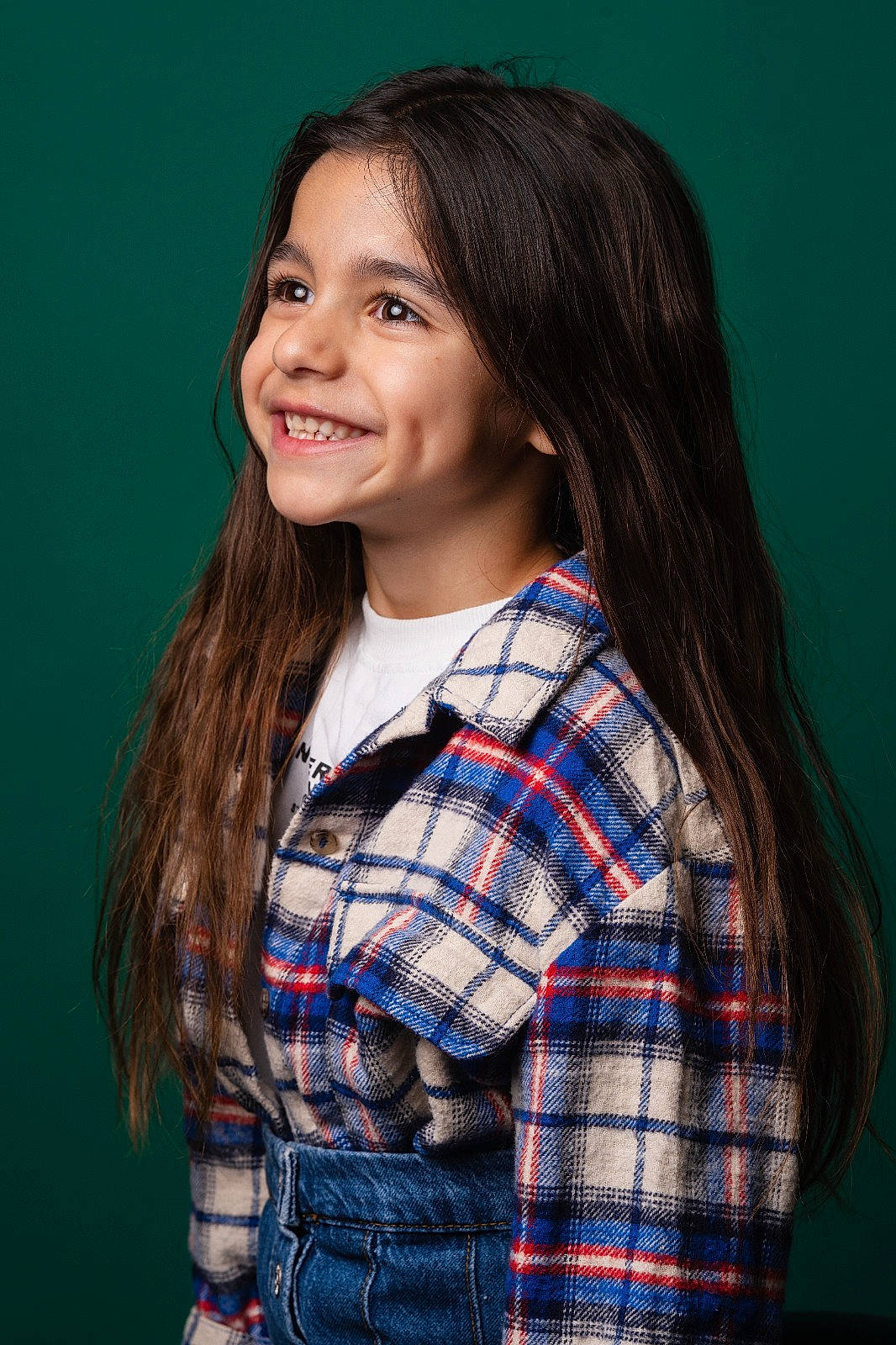 Esmee participe au concours pour gagner de l'argent avec cette photo : black_hair, cheek, chin, clothing, collar, cool, dress_shirt, flash_photography, hair, happy, iris, joy, lip, long_hair, neck, person, plaid, shoulder, skin, sleeve