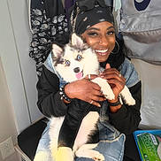 Gucci Couture joined the competition — help win amazing prizes! person, dog, puppy, blue_eyes, smiling, bandana, sunglasses, denim, jacket, bracelet, ring, indoor, bench, wet_wipes, black_clothing, white_fur, happy, pet, cute, holding