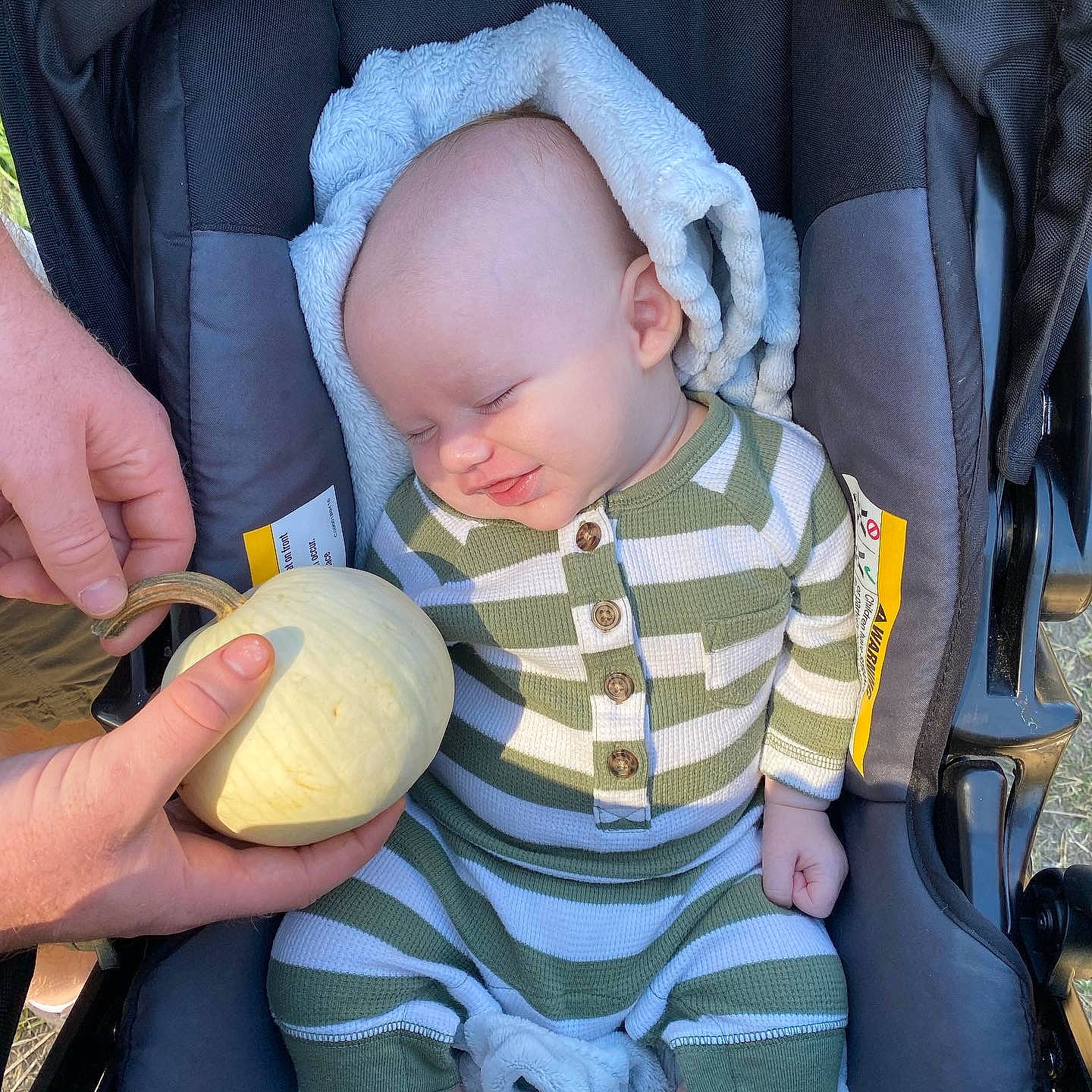 Beckham joined the competition — help win amazing prizes! baby, baby_carriage, baby_products, baby_safety, baby_sleeping, baby_toddler_clothing, car_seat, chair, child, comfort, finger, gesture, grass, hand, nail, person, personal_protective_equipment, sitting, thumb, toddler