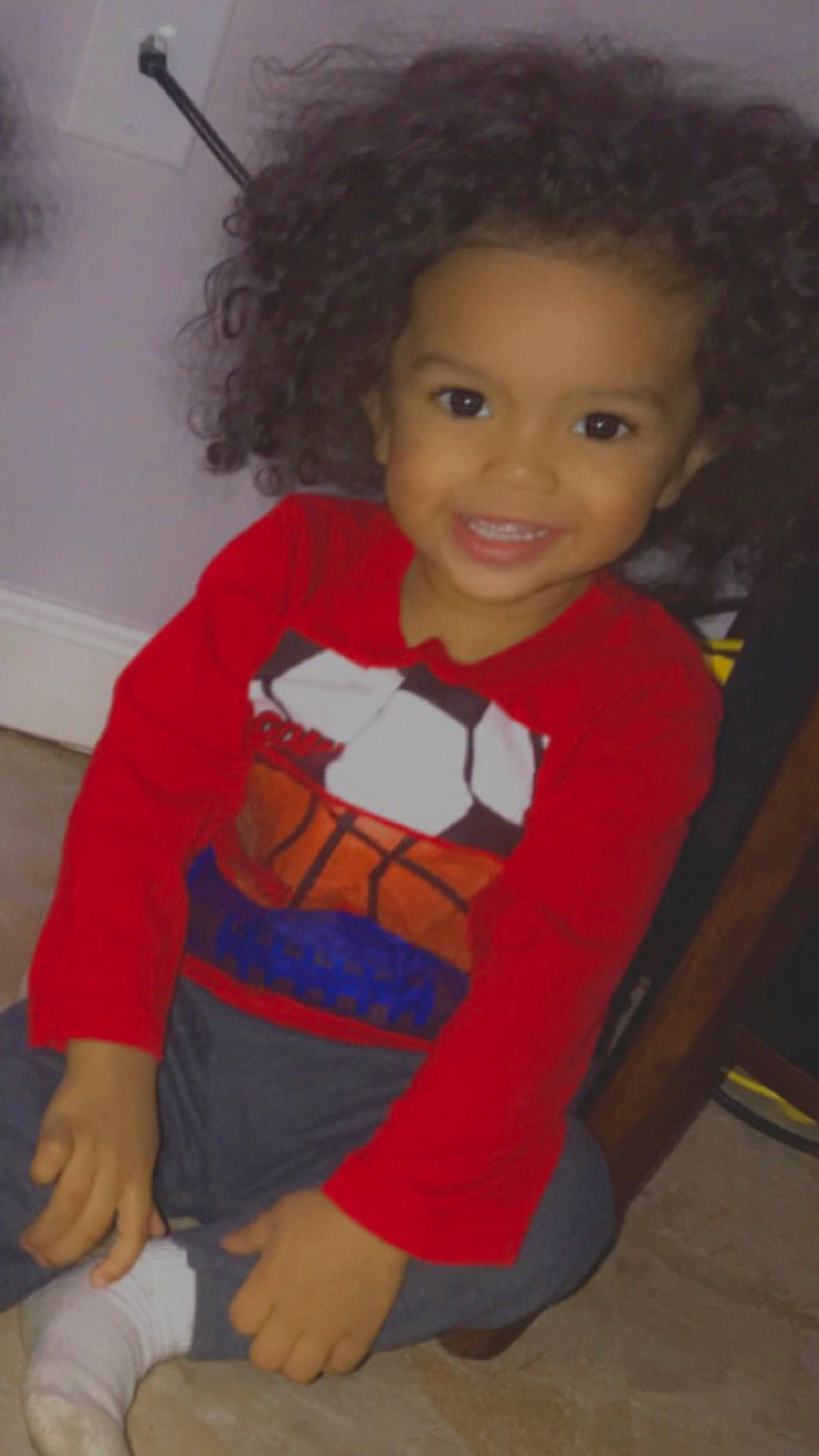 Javion is registered to the contest to win money with this photo: baby_toddler_clothing, cheek, chin, eye, face, floor, fun, hairstyle, head, human_body, iris, joy, lip, nose, organ, person, red, skin, sleeve, smile