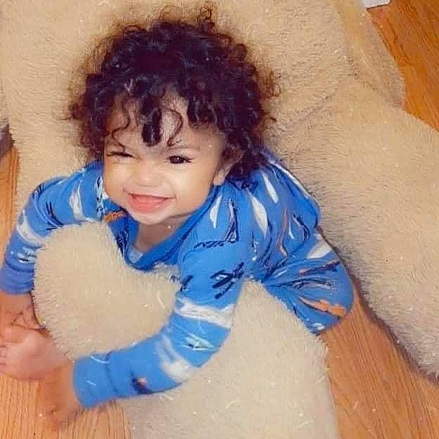 Javion is registered to the contest to win money with this photo: baby, baby_toddler_clothing, cheek, comfort, cool, eye, facial_expression, flooring, fun, gesture, hair, happy, head, iris, joy, nose, person, skin, sleeve, smile