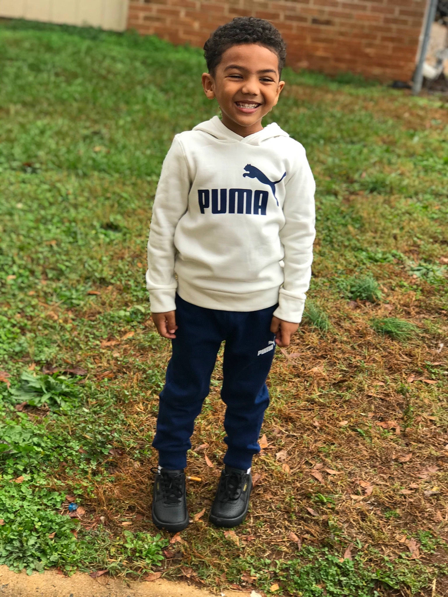 Javoyrio is registered to the contest to win money with this photo: baby_toddler_clothing, child, denim, eye, face, grass, hair, happy, head, joy, people_in_nature, person, shoe, sleeve, smile, soil, street_fashion, t_shirt, toddler, top