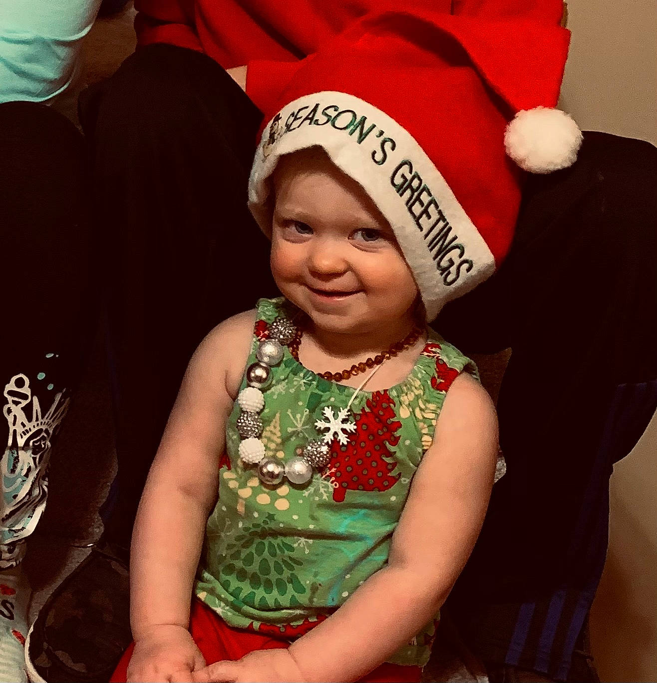 Kyndal is registered to the contest to win money with this photo: baby, baby_toddler_clothing, bonnet, christmas, christmas_eve, costume_accessory, costume_hat, fictional_character, happy, headwear, holiday, joy, laugh, person, pleased, toddler, tradition